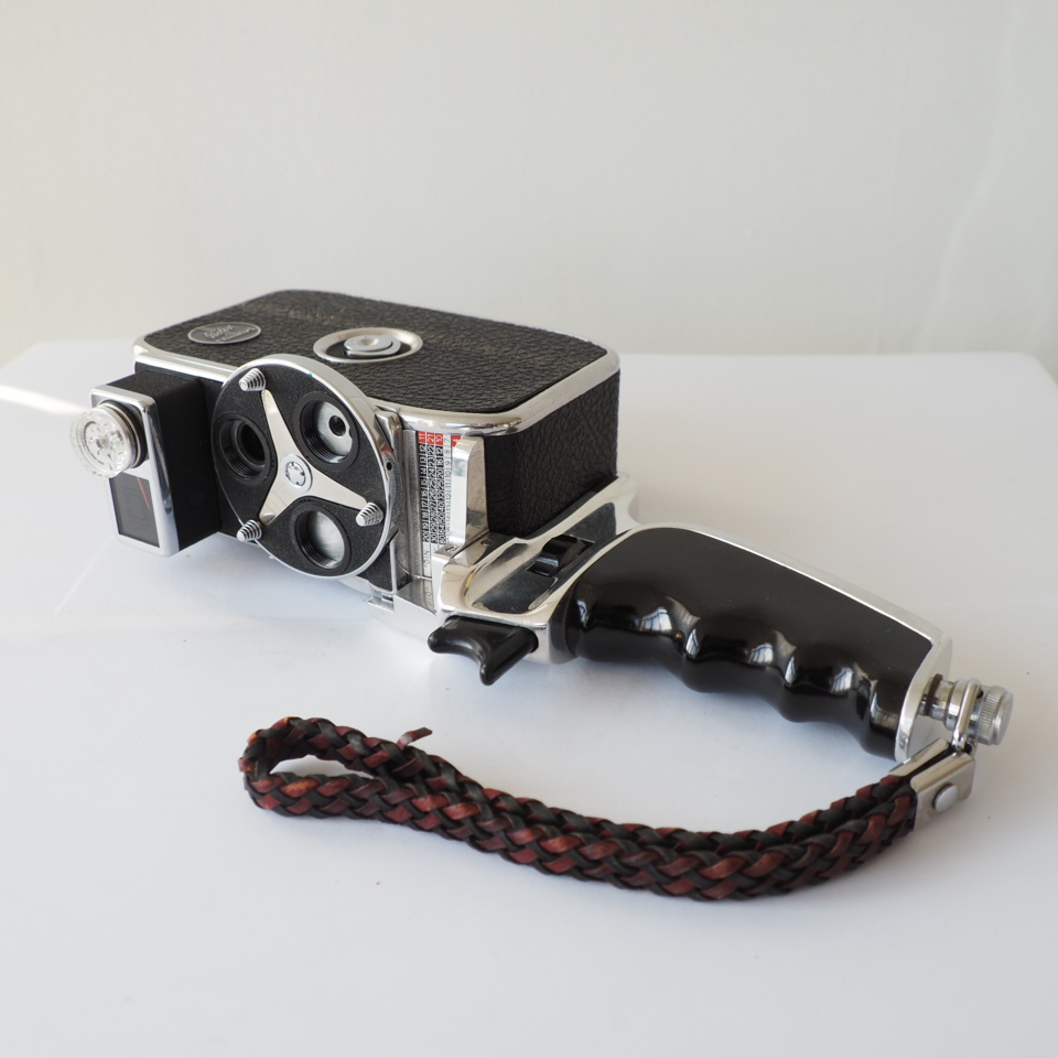 Bolex D8L + grip + polsriem